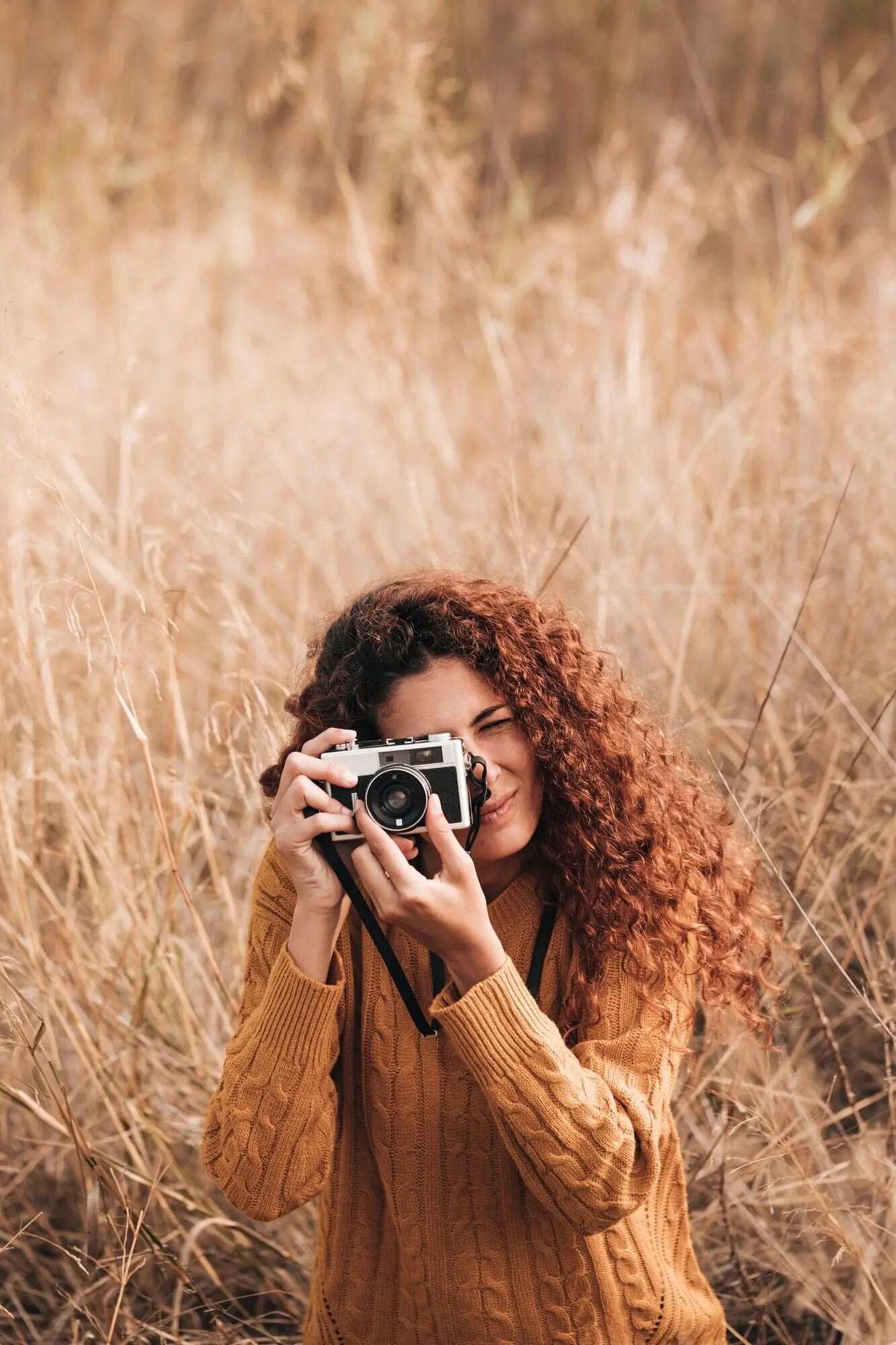 Front view of a woman taking photos