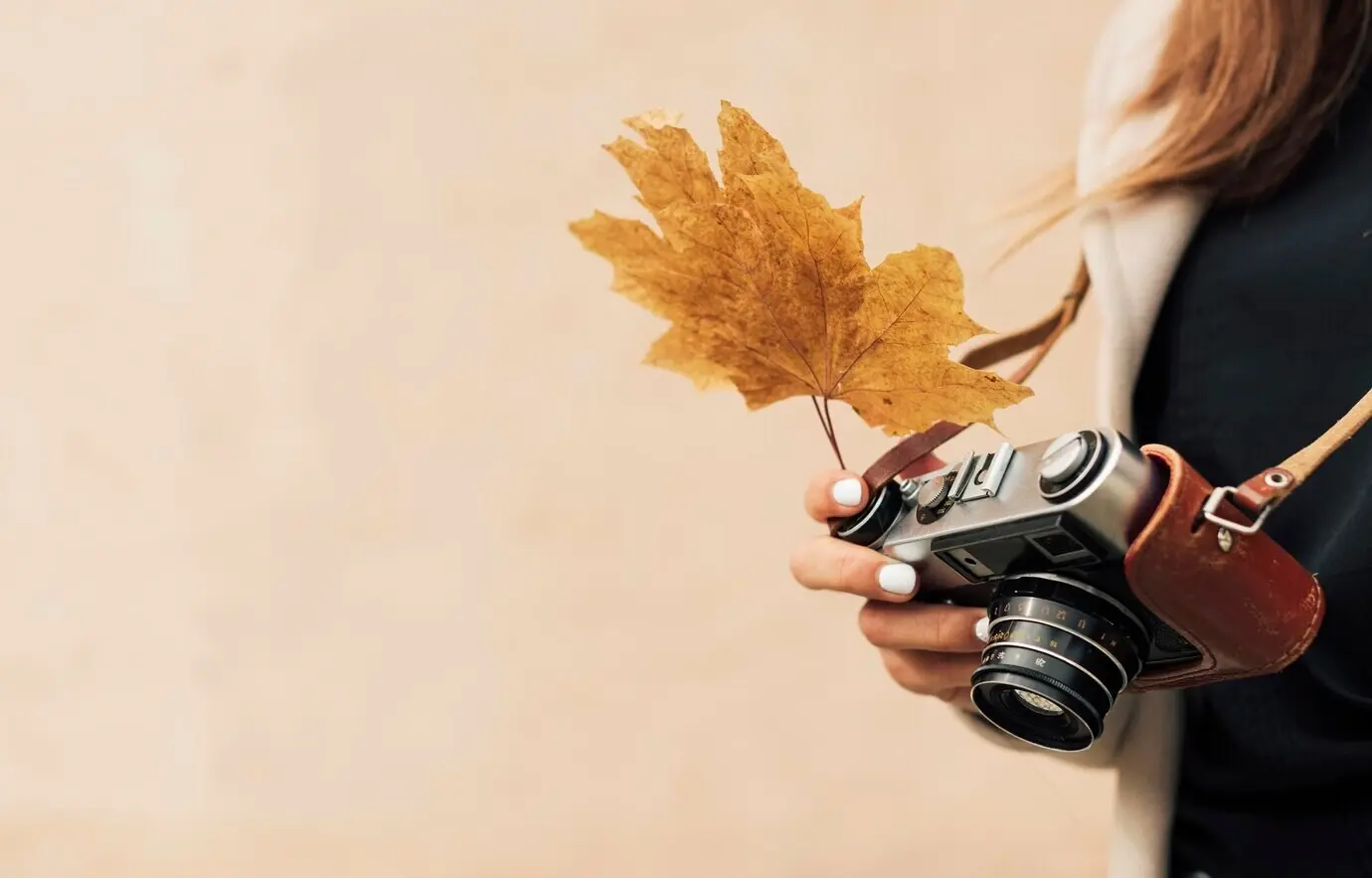 Woman reviewing photos on a camera